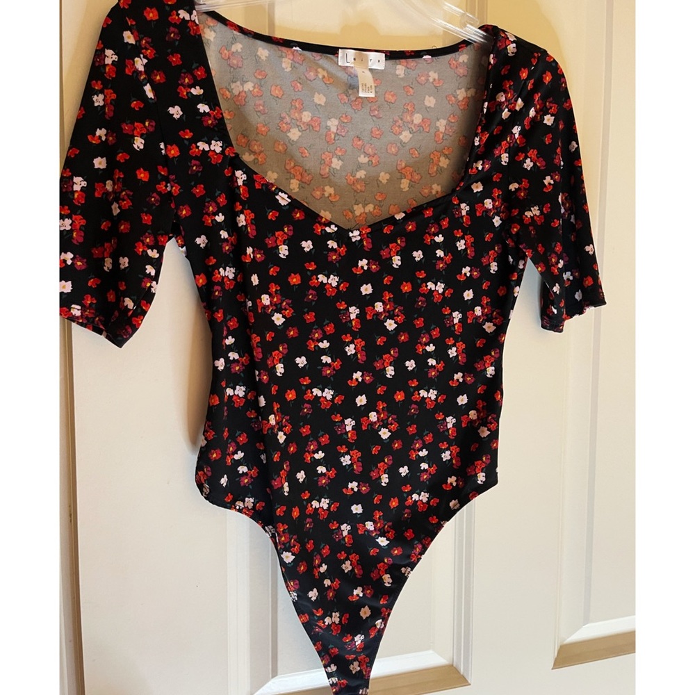Leith short sleeve black body suite with red and white floral pattern